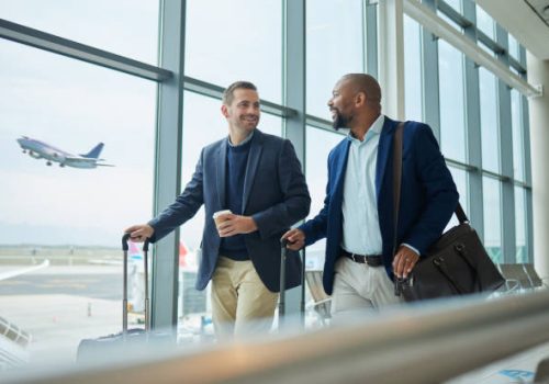 Travel for business, team at airport and men, catch flight for work trip with conference or training seminar with accountant. Walk, talk and diversity with finance convention and partnership